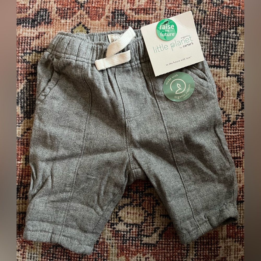 Never worn Little Planet pants (Newborn)